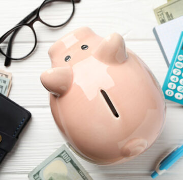 Image depicting various financial options such as coins, dollar bills, and credit cards, representing different ways to pay for assisted living services.