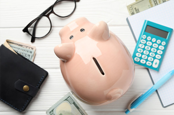 Image depicting various financial options such as coins, dollar bills, and credit cards, representing different ways to pay for assisted living services.
